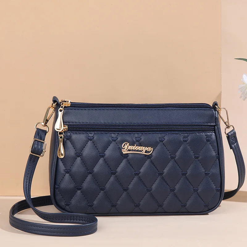 👜 Embroidered Leather Messenger Handbag – Stylish Women's Shoulder Bag with Hair Ball Charm