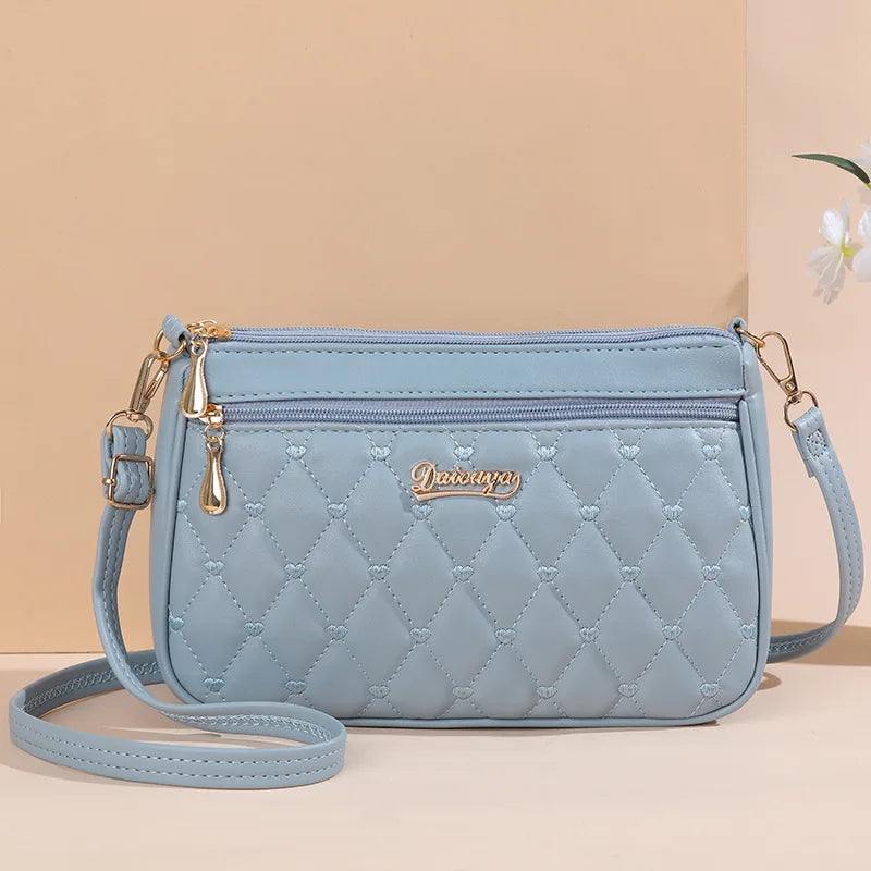 👜 Embroidered Leather Messenger Handbag – Stylish Women's Shoulder Bag with Hair Ball Charm