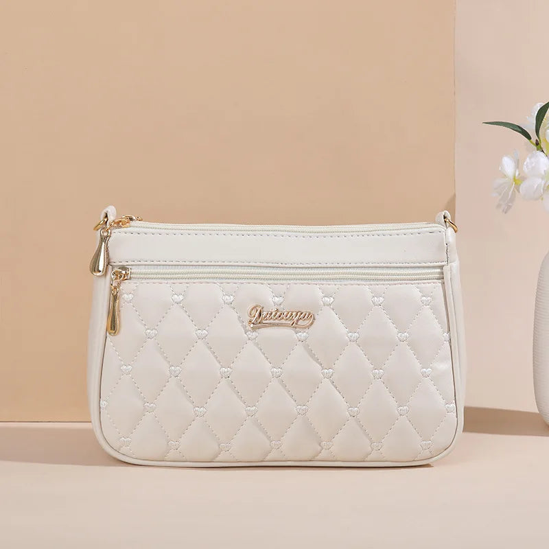 👜 Embroidered Leather Messenger Handbag – Stylish Women's Shoulder Bag with Hair Ball Charm