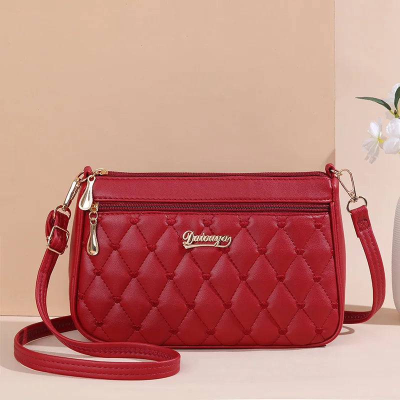 👜 Embroidered Leather Messenger Handbag – Stylish Women's Shoulder Bag with Hair Ball Charm